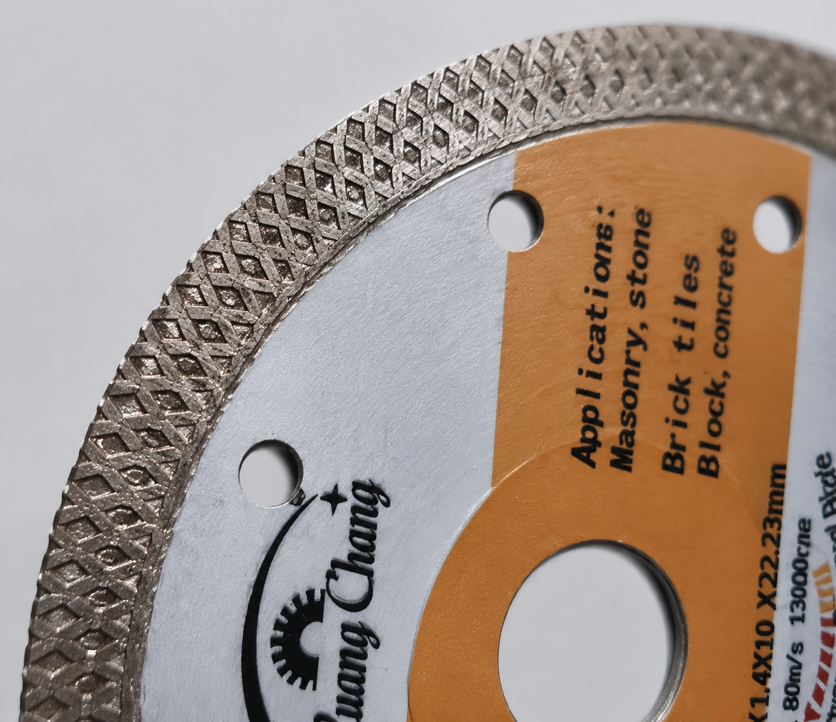 Macro view of segmented diamond rim on 4.5 inch diamond cutting disc.