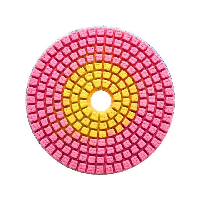 Pink and yellow segmented diamond polishing pad front view