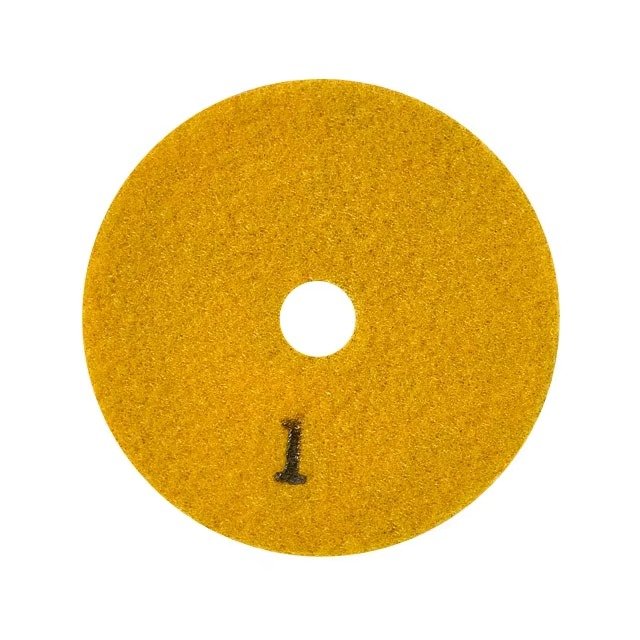 Yellow backing of diamond polishing pad marked step 1