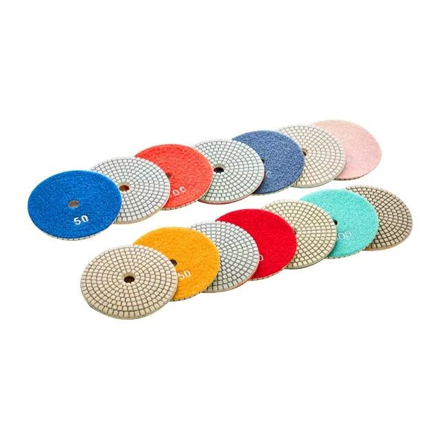 Multiple 100mm wet diamond floor polishing pads shown in assorted grits