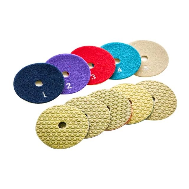 Front and back views of five numbered dry polishing pads