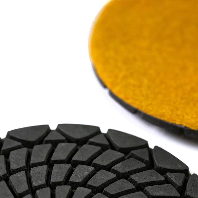 Segmented working face and yellow backing close-up