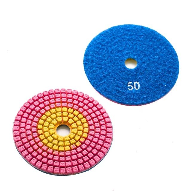 Diamond polishing pad front and blue backing marked 50