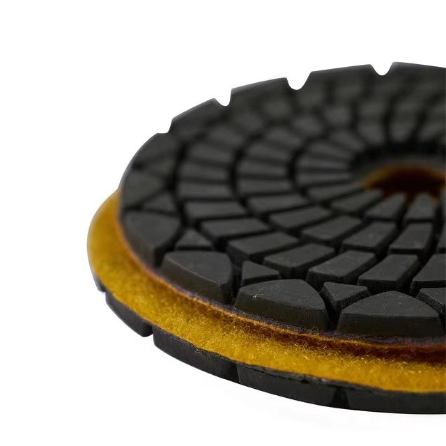 Layered edge detail of diamond polishing pad