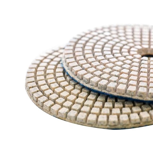 Close up of segmented diamond polishing face on 100mm floor polishing pad