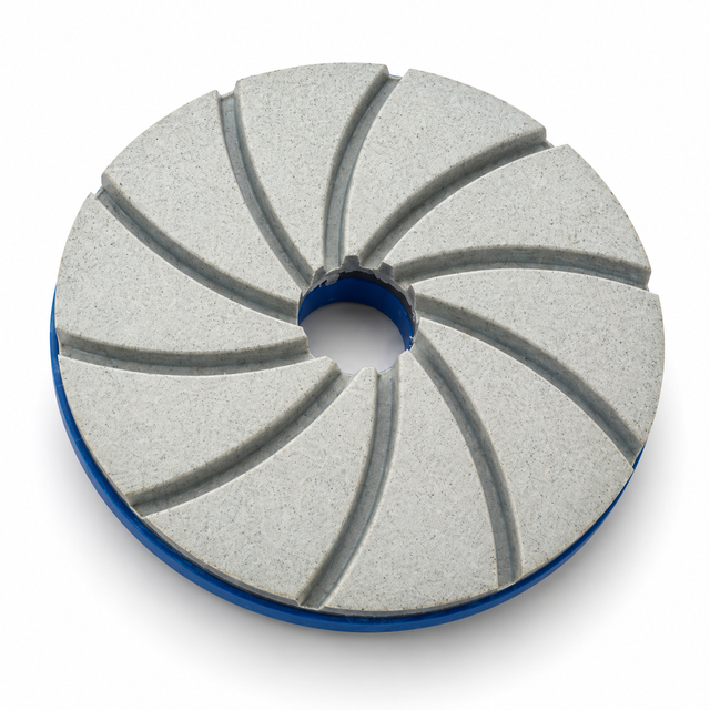 Grey resin diamond polishing wheel with curved grooves and a blue Snail Lock backing on white.