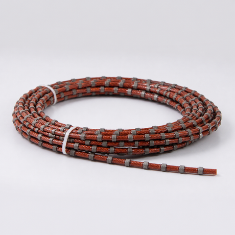 Coiled rubber coated diamond wire saw with sintered diamond beads