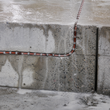 Rubber coated diamond wire saw wet cutting reinforced concrete